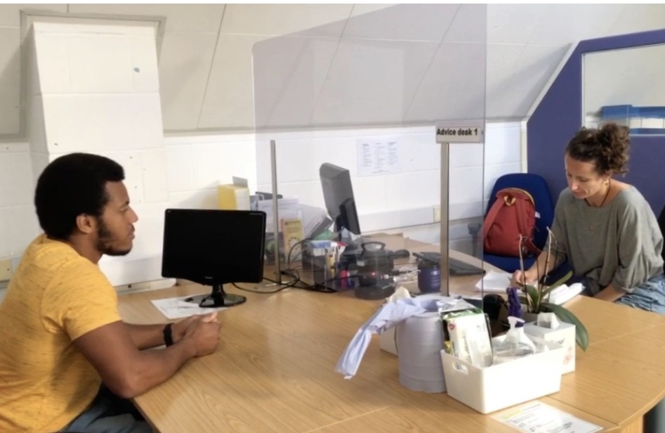 Man sitting at Advice desk at MAP