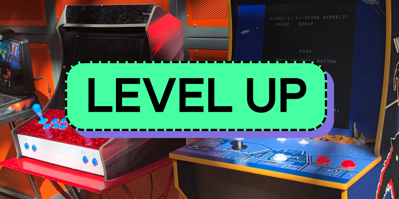 The words 'level up' over two arcade machines