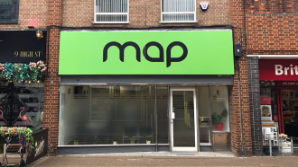 Big green 'MAP' sign on the front of the MAP King's Lynn building on the high street