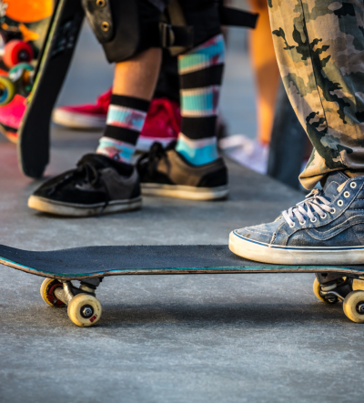 A young person stood on a skateboard