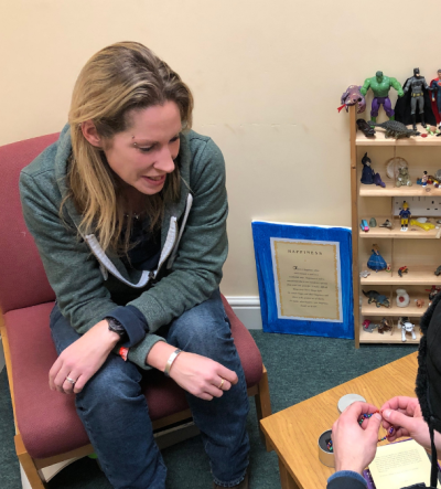 adult talking to young person about mental health