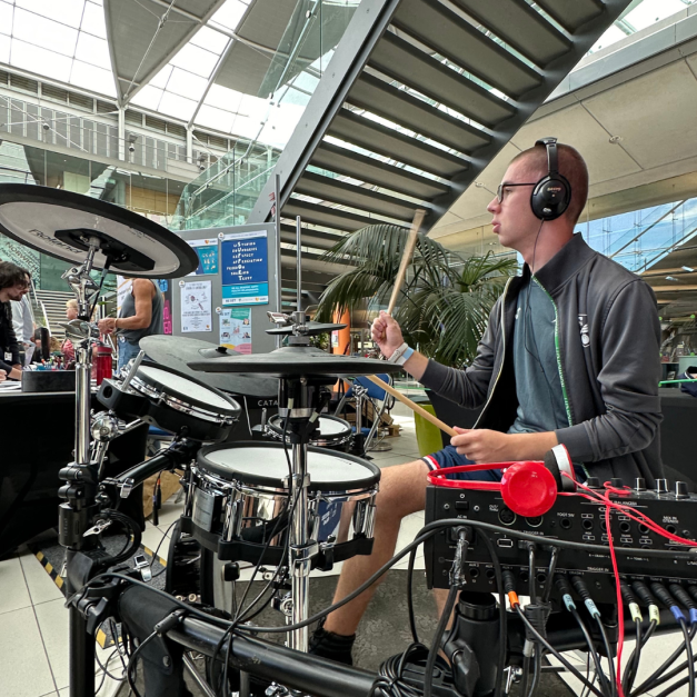Young person playing the drums