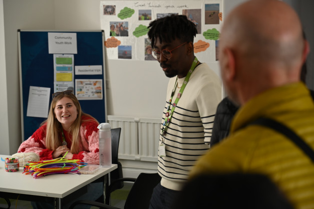 Three youth workers chatting in the Great Yarmouth MAP drop-in