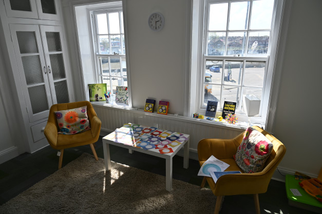 Two chairs in a sunny counselling room