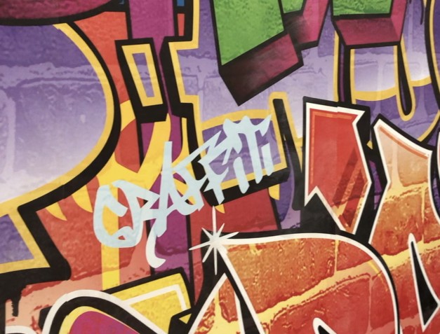 Close up image of a graffiti wall
