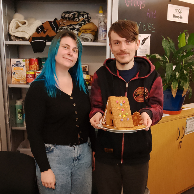 Youth worker and a young person stood in the risebrow drop-in centre