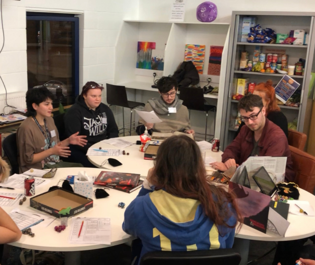 A group of young people playing Dungeons and Dragons in the Norwich drop-in centre