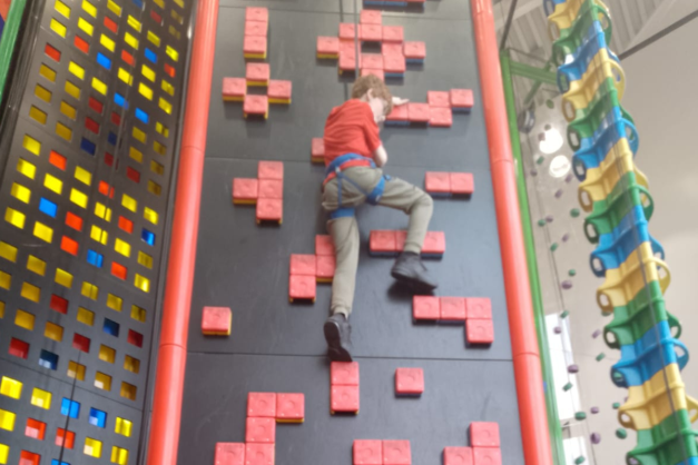 Young person on a climbing wall